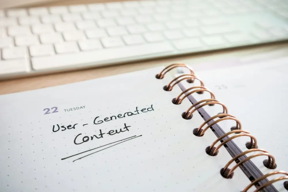 A spiral notebook with the words user - generated content on it