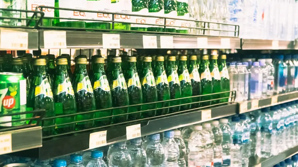A display in a store filled with lots of bottles of water, illustrating choosing bottles